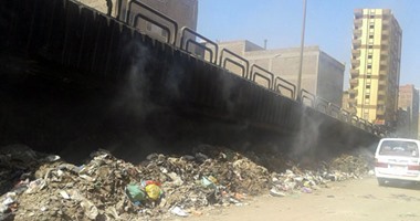 بالصور.. القمامة المشتعلة تتسبب فى انتشار الأمراض بشارع المطاحن فى بشتيل
