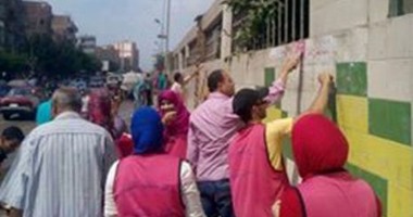 200 شاب من الشرقية يزيلون الملصقات المسيئة من الزقازيق