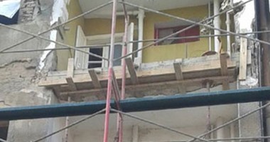 بالصور.. حى غرب شبرا الخيمة يواصل ترميم الشقق المجاورة لمبنى الأمن الوطنى