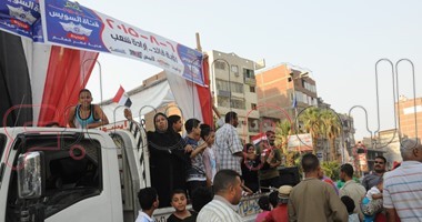 احتفالات بشوارع الجيزة بافتتاح قناة السويس الجديدة