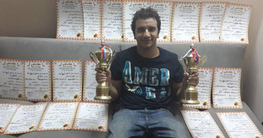 "باسم" أصغر بطل فى رياضة "سباق الحمام الزاجل"