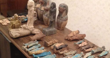 ضبط عدد من القطع يشتبه فى أثريتها بنجع حمادى