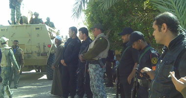 اتهام سائق بالاعتداء على ضابط ومحاولة الاستيلاء على "لاسلكى" بالدقى