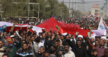 بالصور.. أنصار "الصدر" يتظاهرون بالعراق دعما لاحتجاجات البحرين 