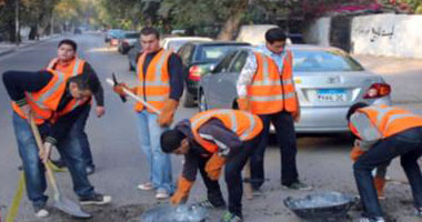 شباب ناهيا يشاركون "مرسى" فى تنظيف شوارع بلدتهم