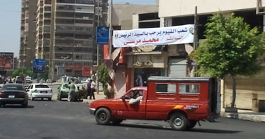 الأغانى الوطنية فى الشوارع و"الأمن" ينتشر لاستقبال الرئيس فى الفيوم