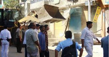 حملة إزالة كبرى لتعديات شارع العشرينى بالإسماعيلية